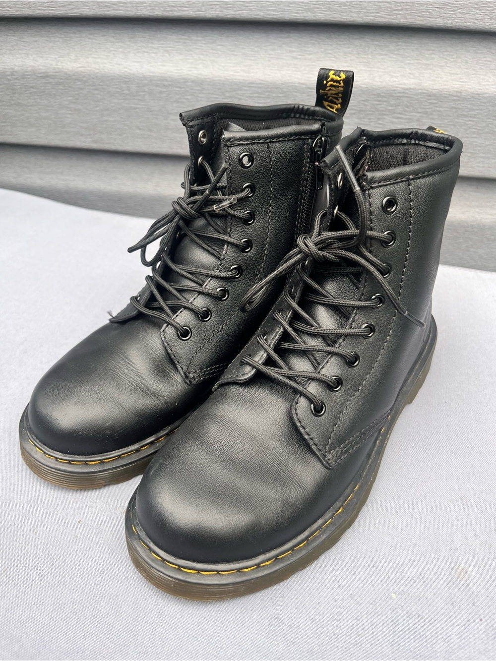 Dr. Martens Black Leather Ankle Boots with Yellow Heel Loop